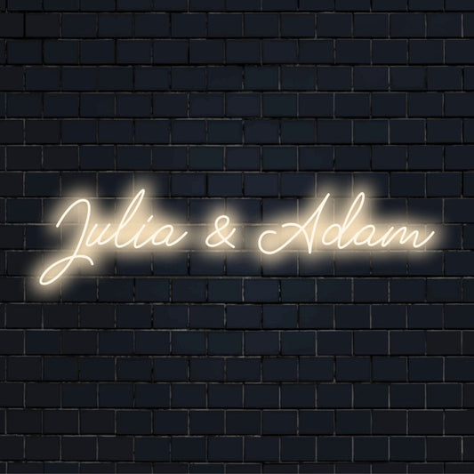 Julia _ Adam Custom Name Neon Sign, bright neon glow on dark brick wall