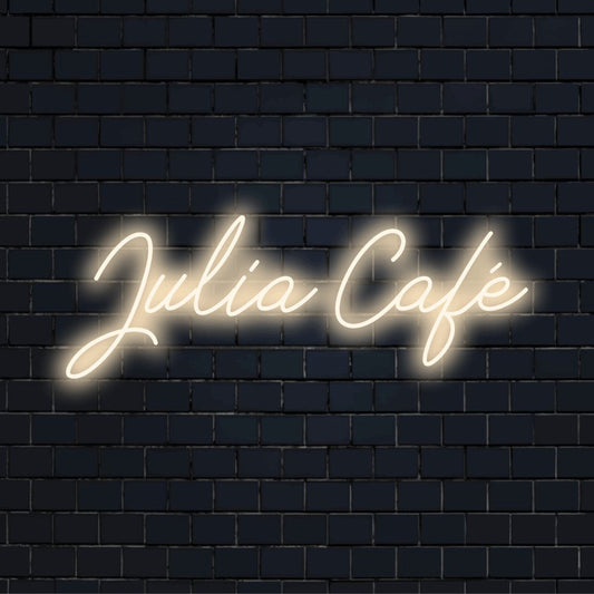 Julia Cafe Custom Name Neon Sign, bright neon glow on black brick background