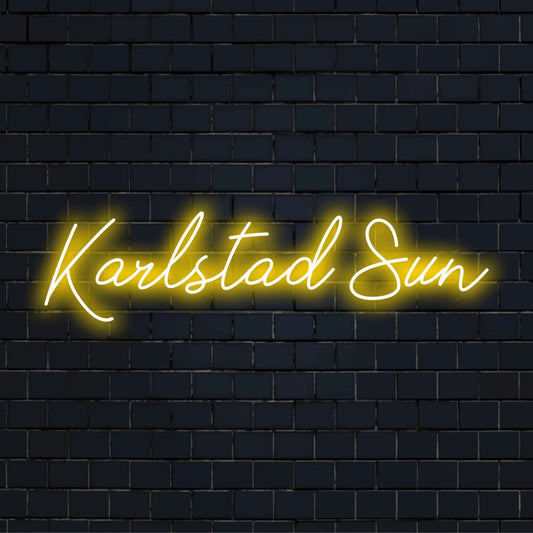 Karlstad Sun Neon Light with bright neon lettering on black brick background