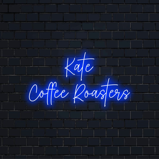Kate Coffee Roasters Custom Name Neon Sign, glowing lettering on dark brick background