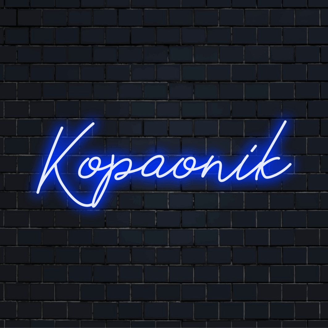 Kopaonik LED Neon Sign, bright LED glow against black brick wall