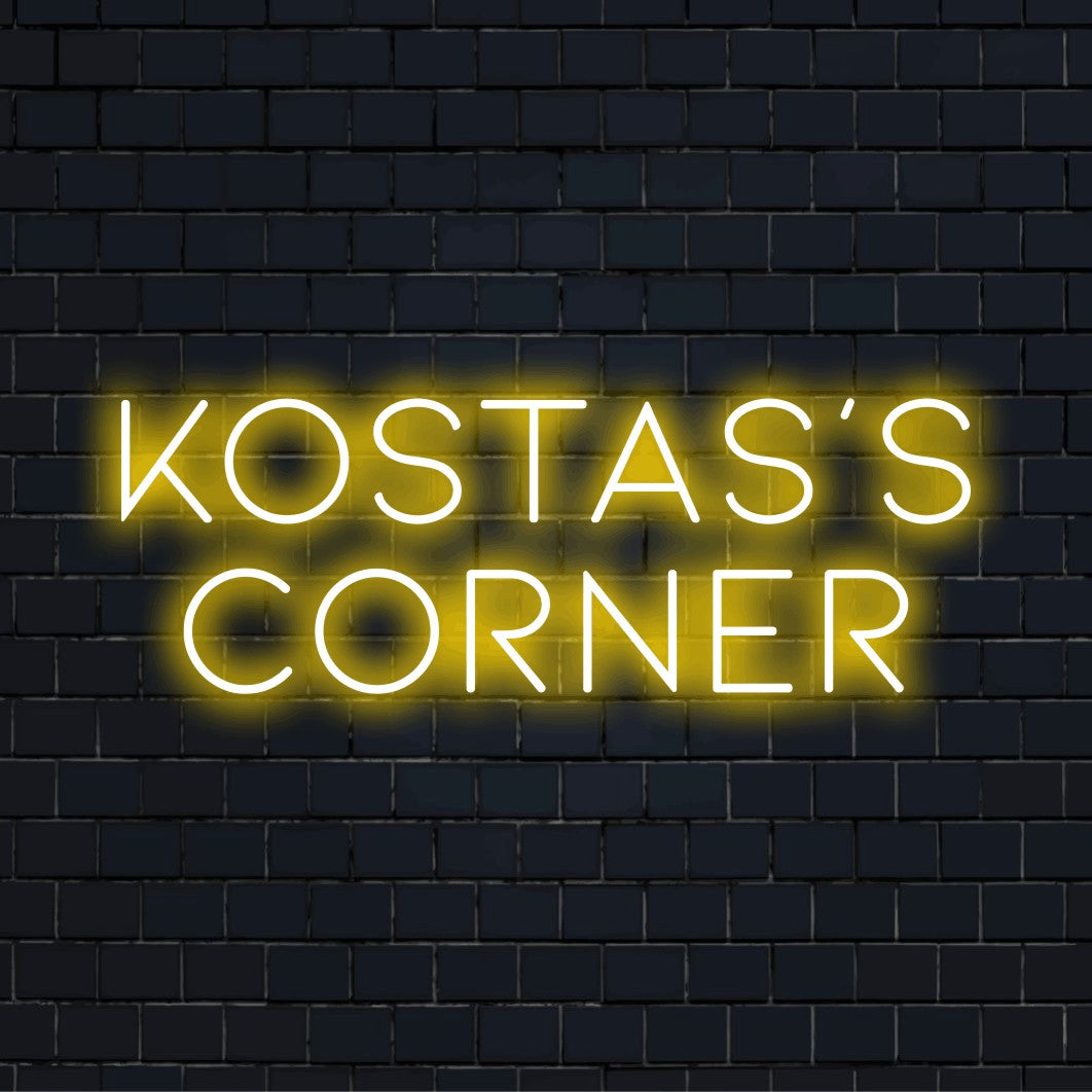 Kostas_s Corner Personalized Neon Light with bright neon lettering against black brick wall
