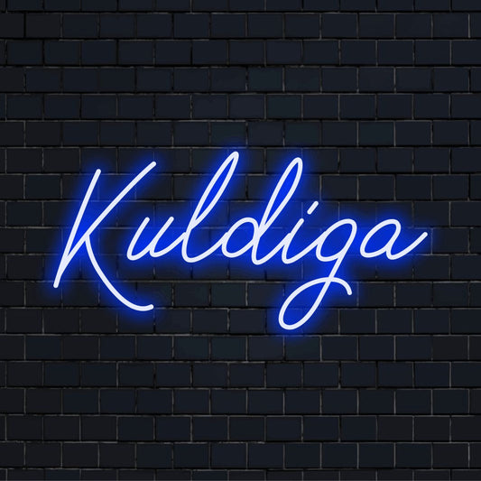 Kuldiga Neon Sign, glowing lettering on dark brick wall