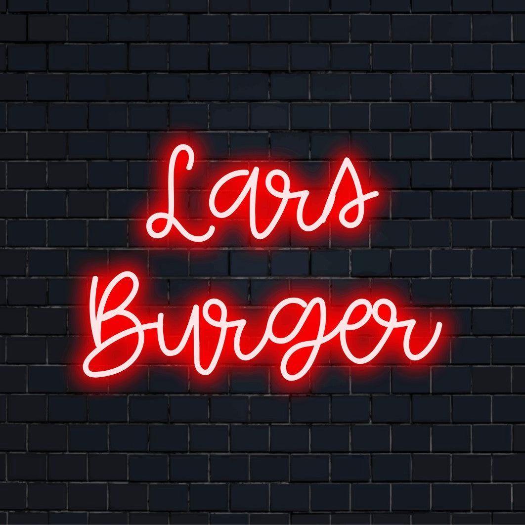 Lars Burger Personalized Neon Light with glowing neon text against black brick wall