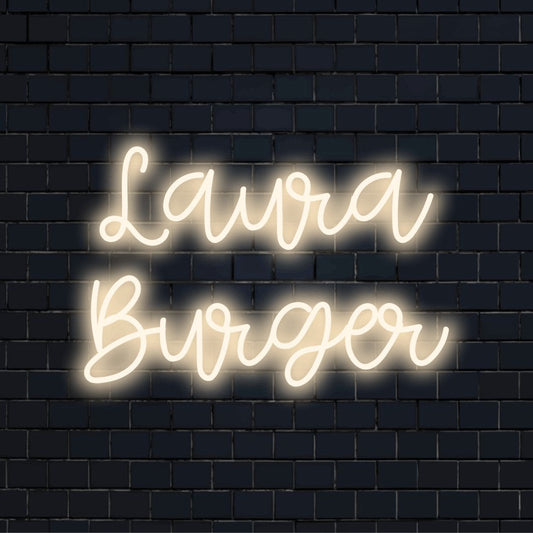 Laura Burger Personalized LED Neon Sign, glowing lettering on dark brick wall