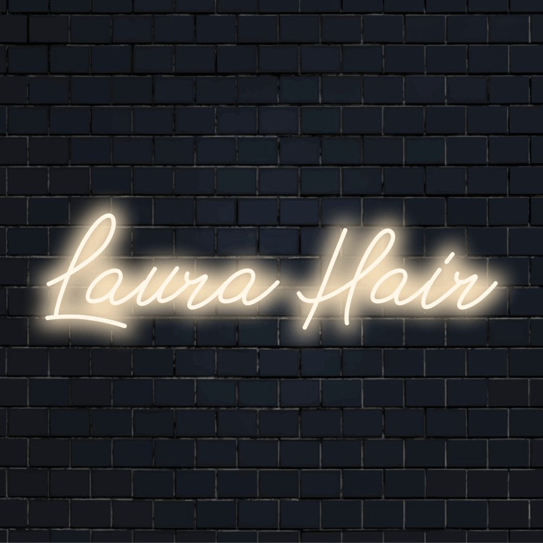 Laura Hair Personalized LED Neon Sign, glowing lettering against brick backdrop