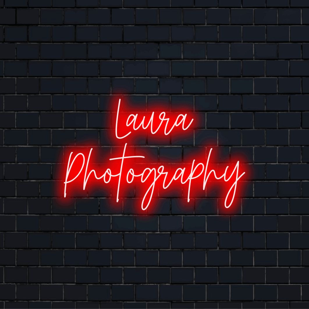 Laura Photography Personalized LED Neon Sign, glowing neon text on dark brick background