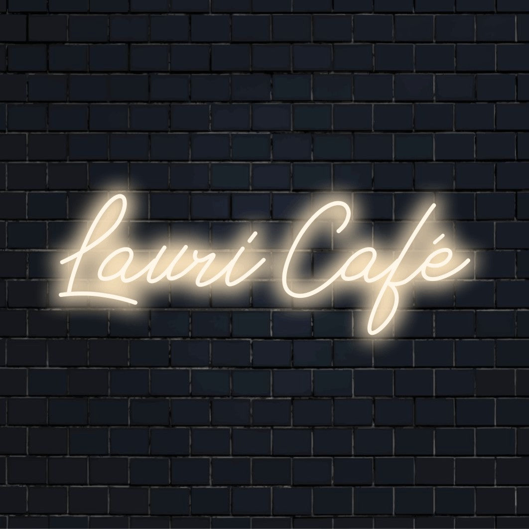 Lauri Cafe Custom Name Neon Sign, bright neon glow against brick backdrop