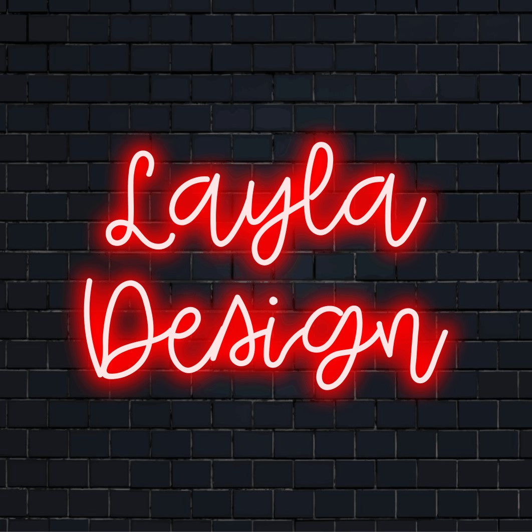 Layla Design Personalized LED Neon Sign, glowing lettering on black brick background