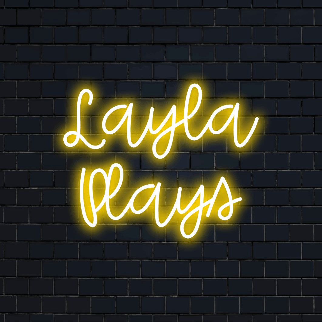 Layla Plays Personalized LED Neon Sign, neon text light against brick backdrop
