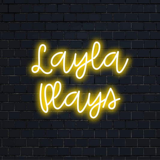 Layla Plays Personalized LED Neon Sign, neon text light against brick backdrop