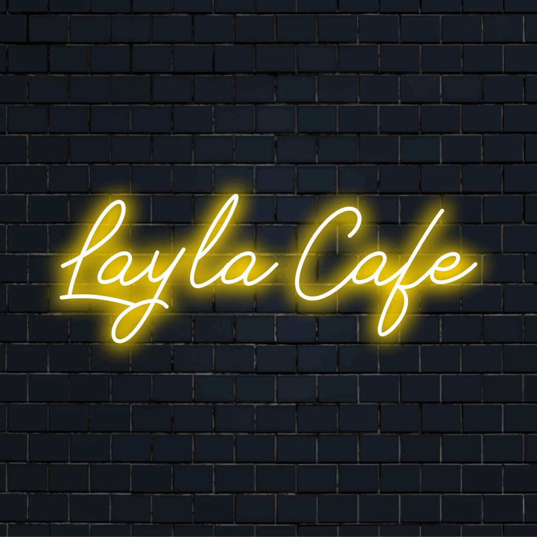 Layla Cafe Custom Name Neon Sign, glowing neon text on dark brick background