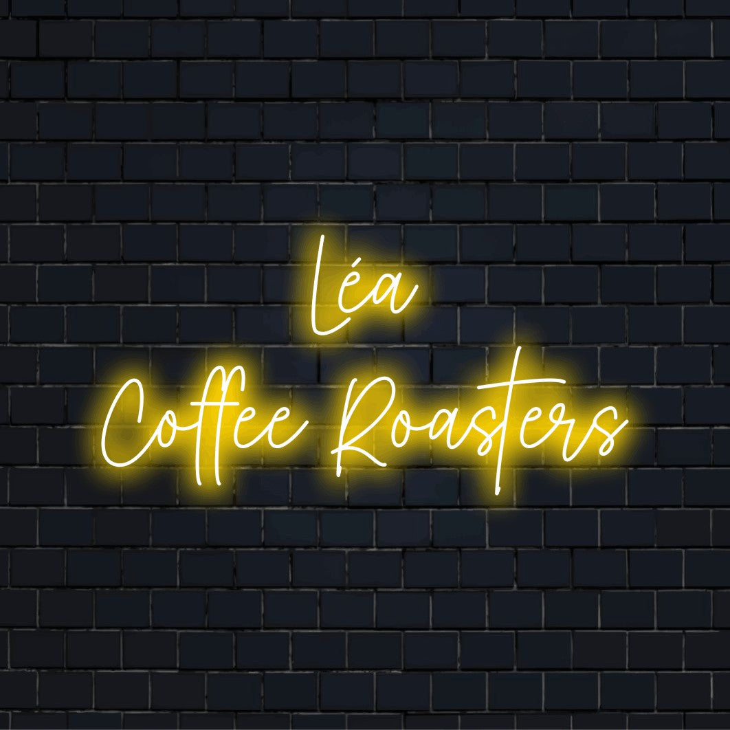 Lea Coffee Roasters Personalized Neon Light with soft neon glow against brick backdrop