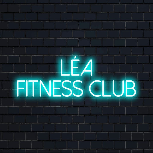 Lea Fitness Club Custom Name Neon Sign, glowing lettering against brick backdrop