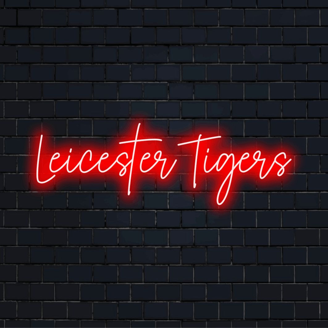 Leicester Tigers Neon Sign, glowing lettering on dark brick wall