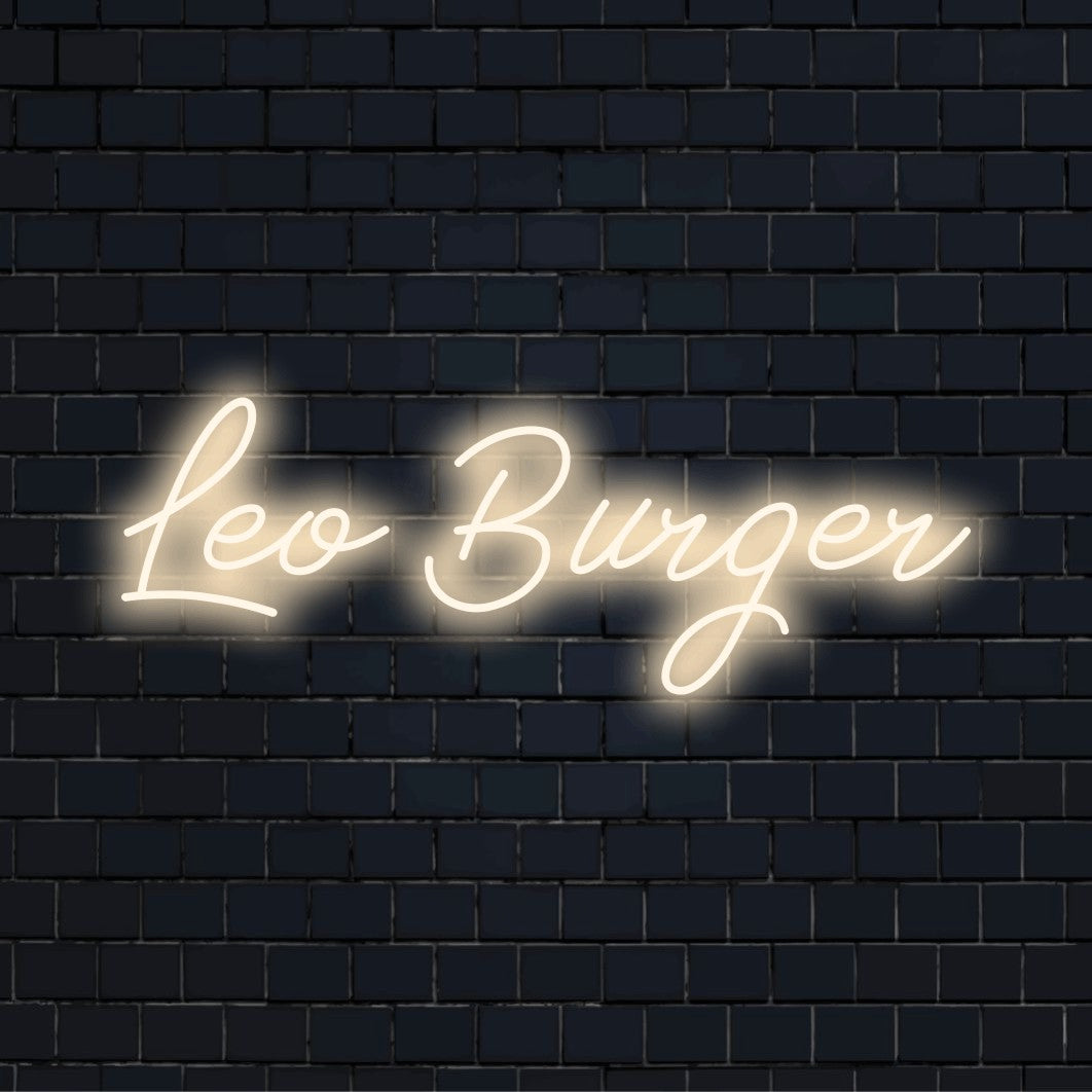 Leo Burger Personalized Neon Light with glowing wall decor on dark brick background