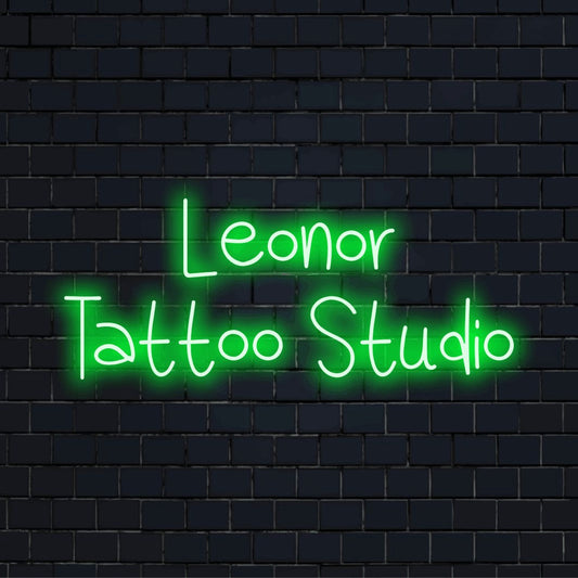 Leonor Tattoo Studio Custom Name Neon Sign, soft neon glow on black brick background