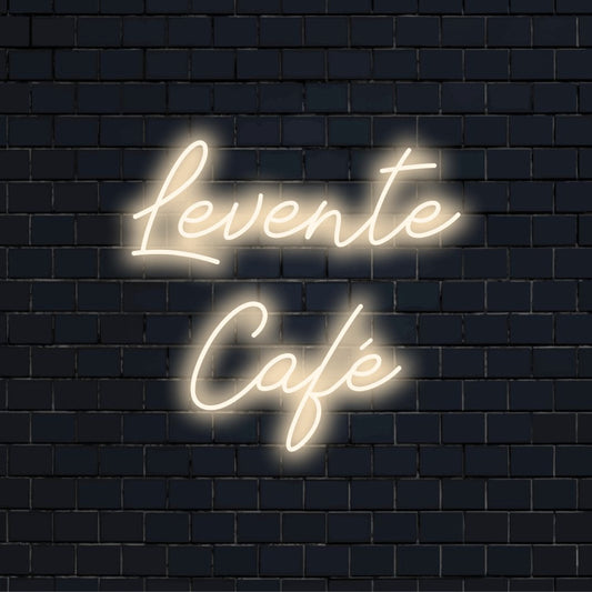 Levente Cafe Personalized LED Neon Sign, glowing neon text against black brick wall