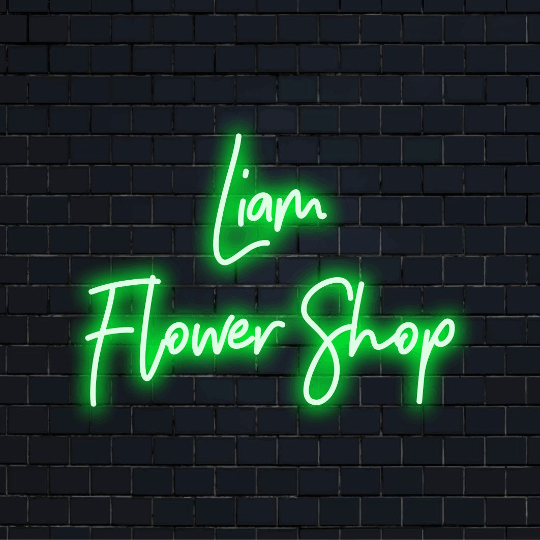 Liam Flower Shop Custom Name Neon Sign, bright neon glow on black brick background