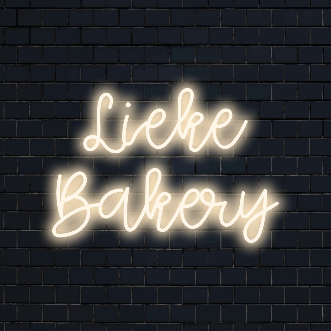 Lieke Bakery Personalized LED Neon Sign, bright neon lettering on black brick background