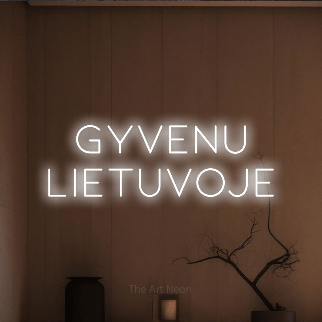 LED neon sign reading “GYVENU LIETUVOJE”, arranged in two lines.