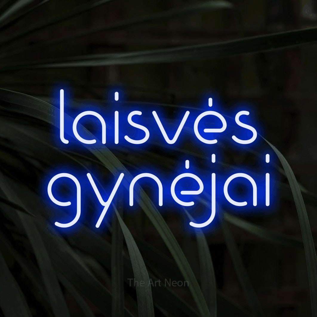 LED neon sign reading “laisvės gynėjai”, arranged in two lines.