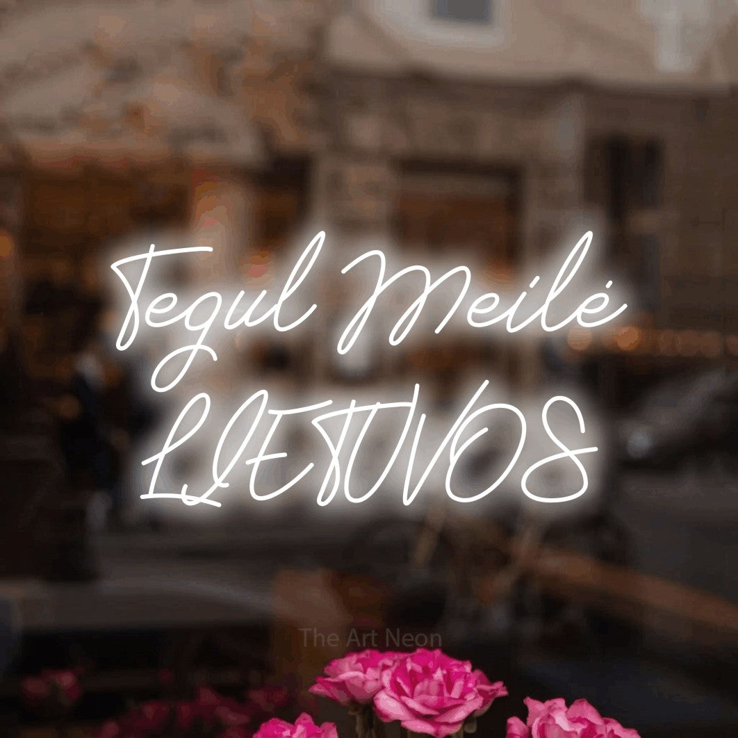 LED neon sign reading “Tegul Meilė LIETUVOS”, arranged in two lines.
