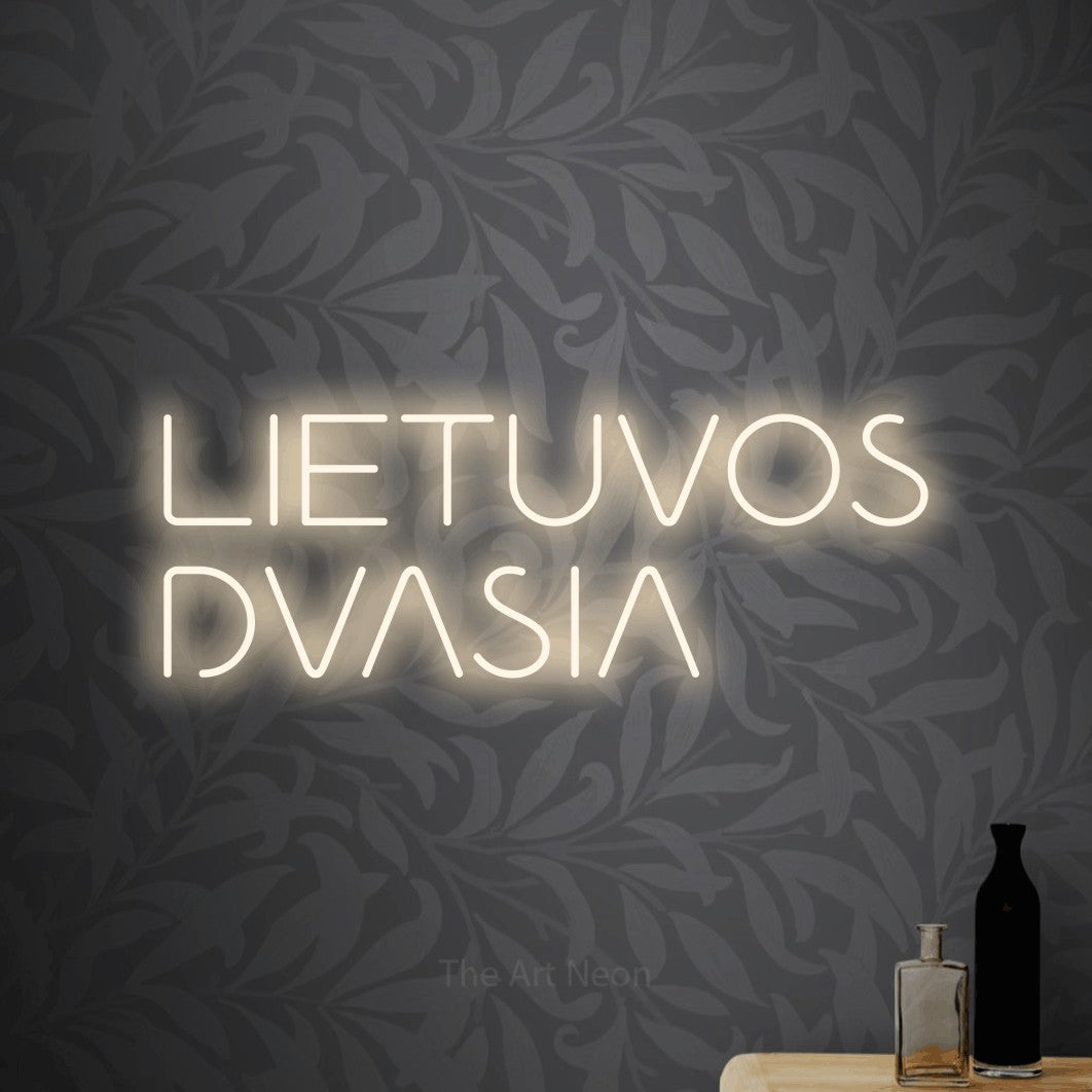 LED neon sign reading “LIETUVOS DVASIA”, arranged in two lines.
