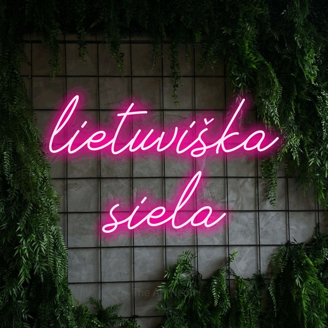 LED neon sign reading “lietuviška siela”, arranged in two lines.