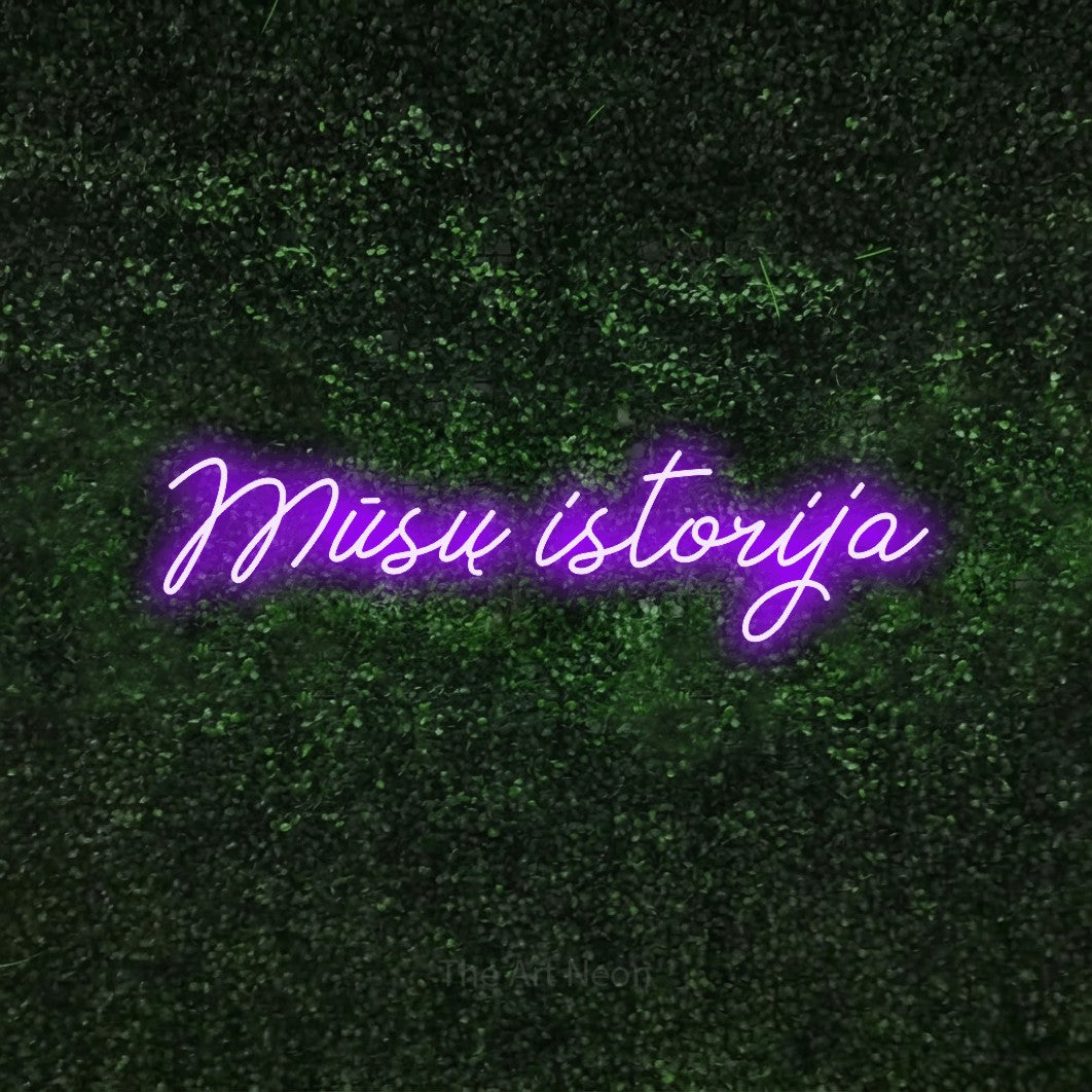 LED neon sign reading “Mūsų istorija”, arranged in a single line.