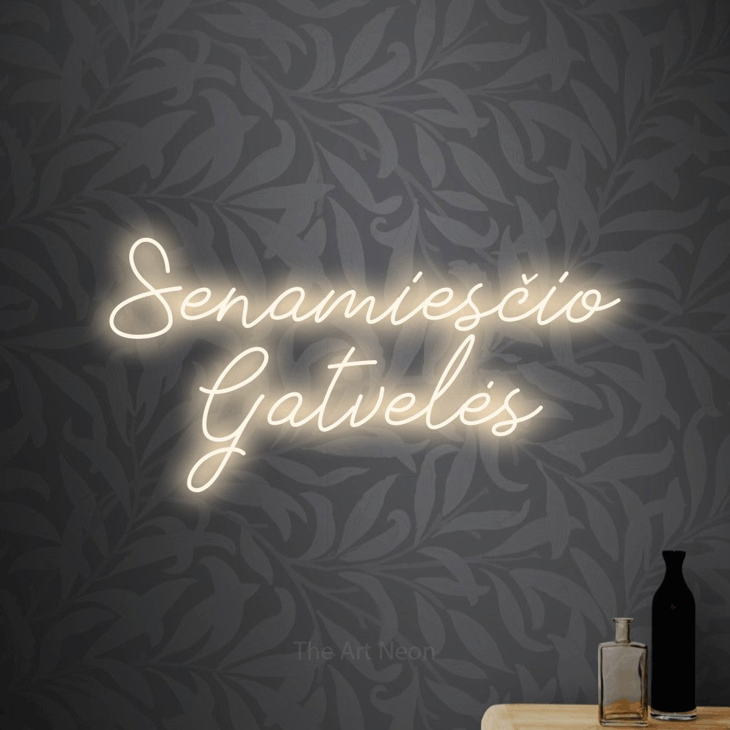 LED neon sign reading “Senamiesčio Gatvelės”, arranged in two lines.