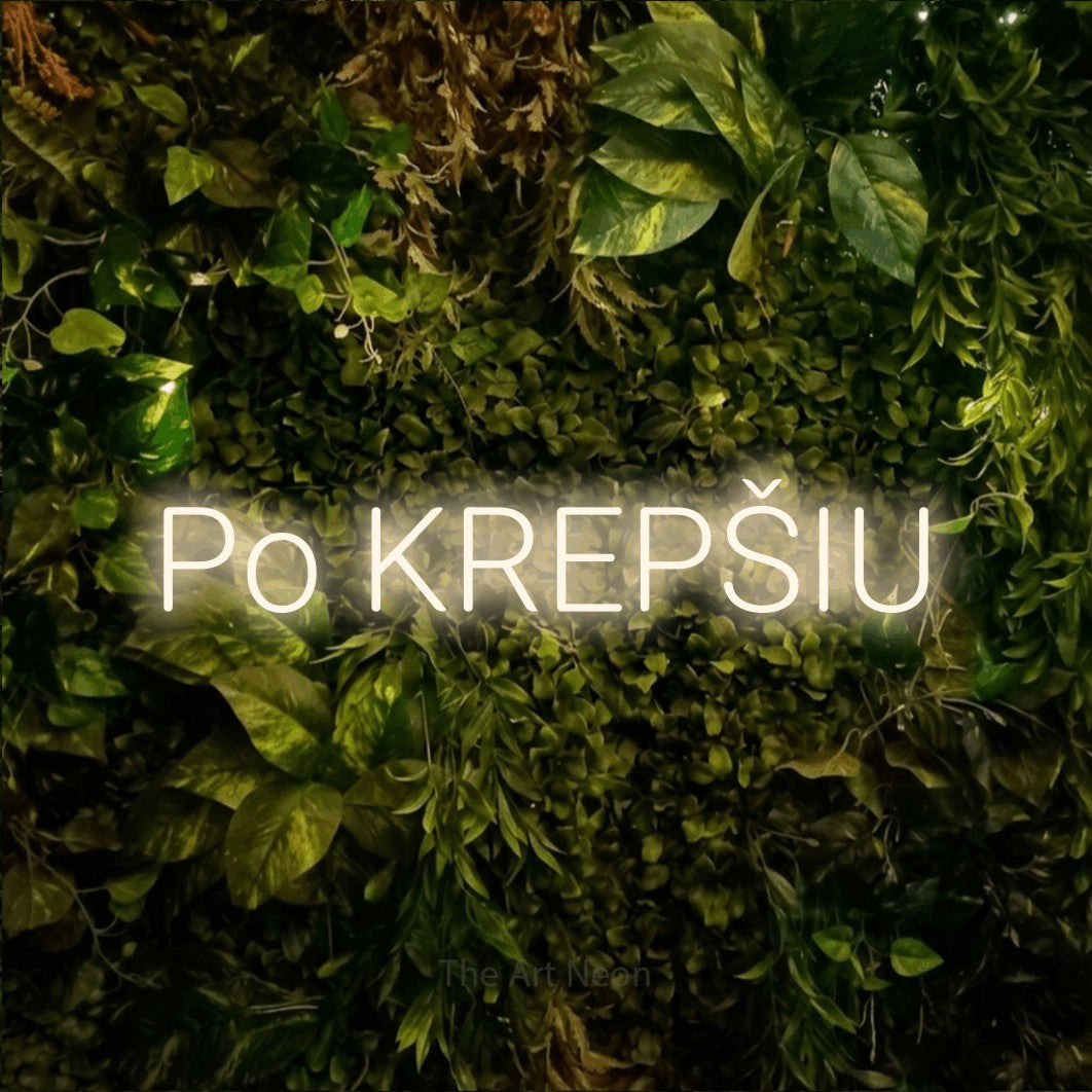 LED neon sign reading “Po KREPŠIU”, arranged in a single line.