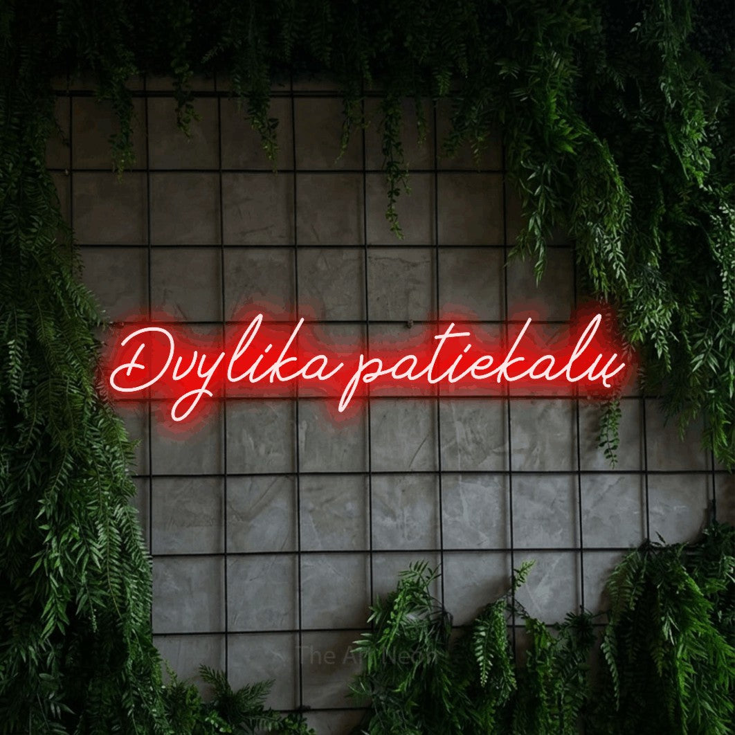 LED neon sign reading “Dvylika patiekalų”, arranged in a single line.