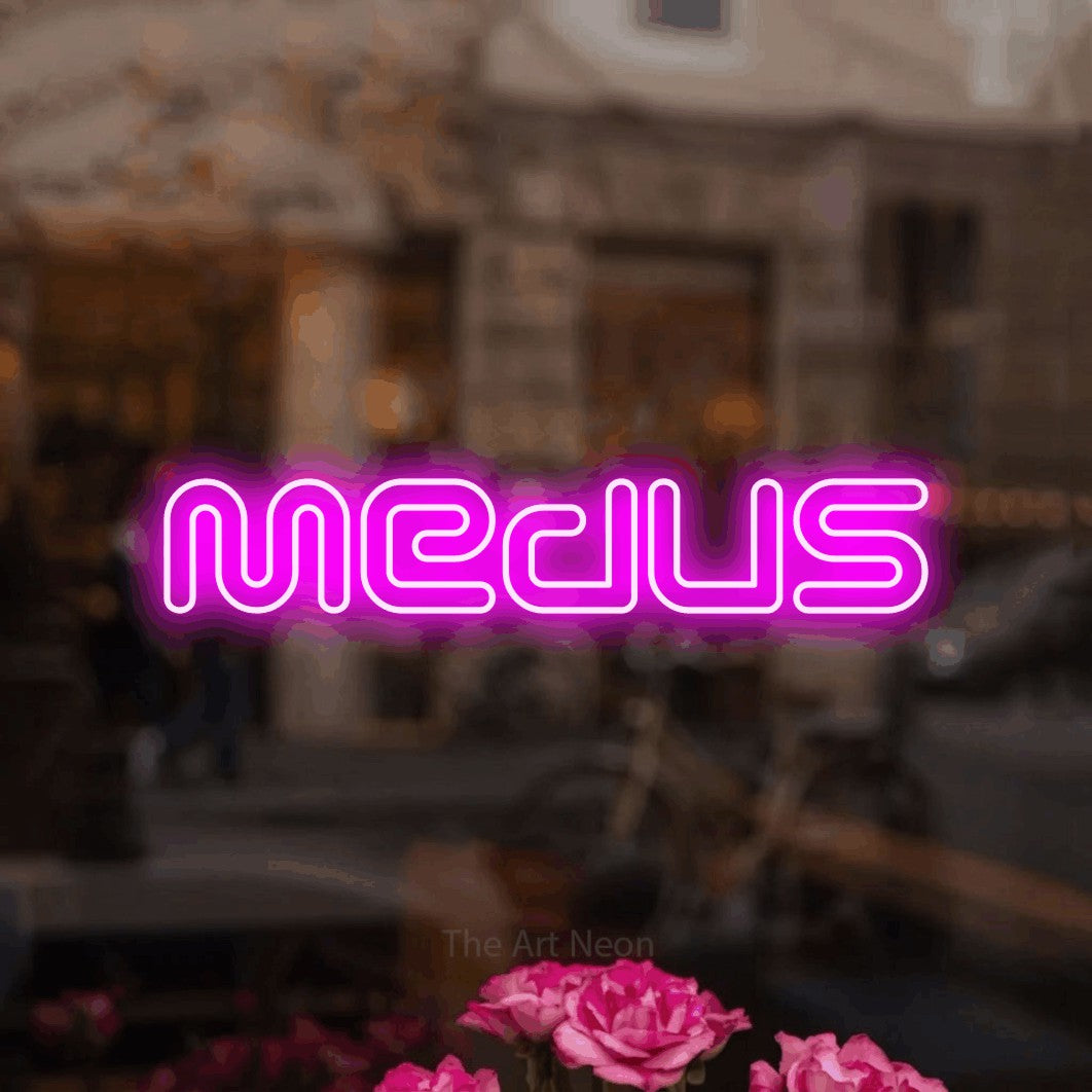 LED neon sign reading “Medus”, arranged in a single line.