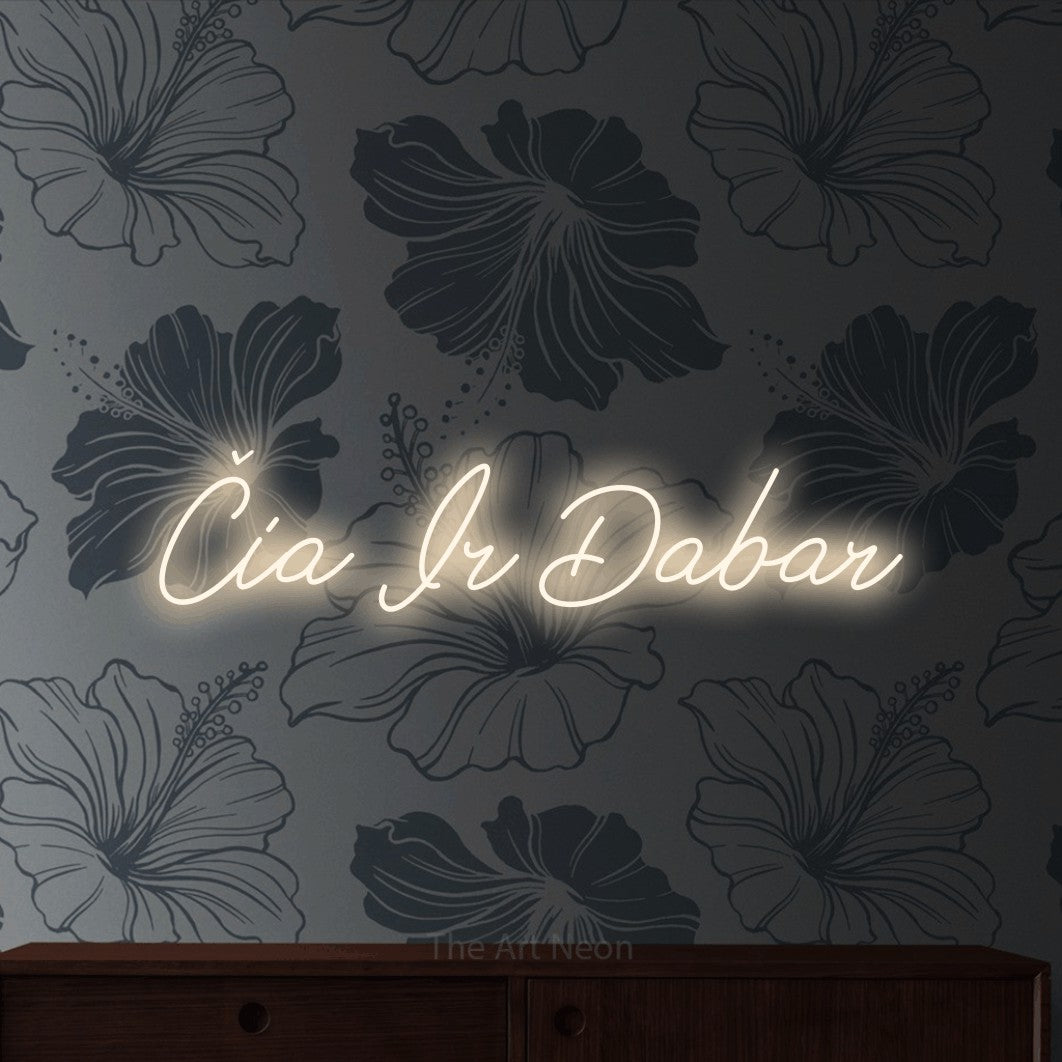 LED neon sign reading “Čia Ir Dabar”, arranged in a single line.