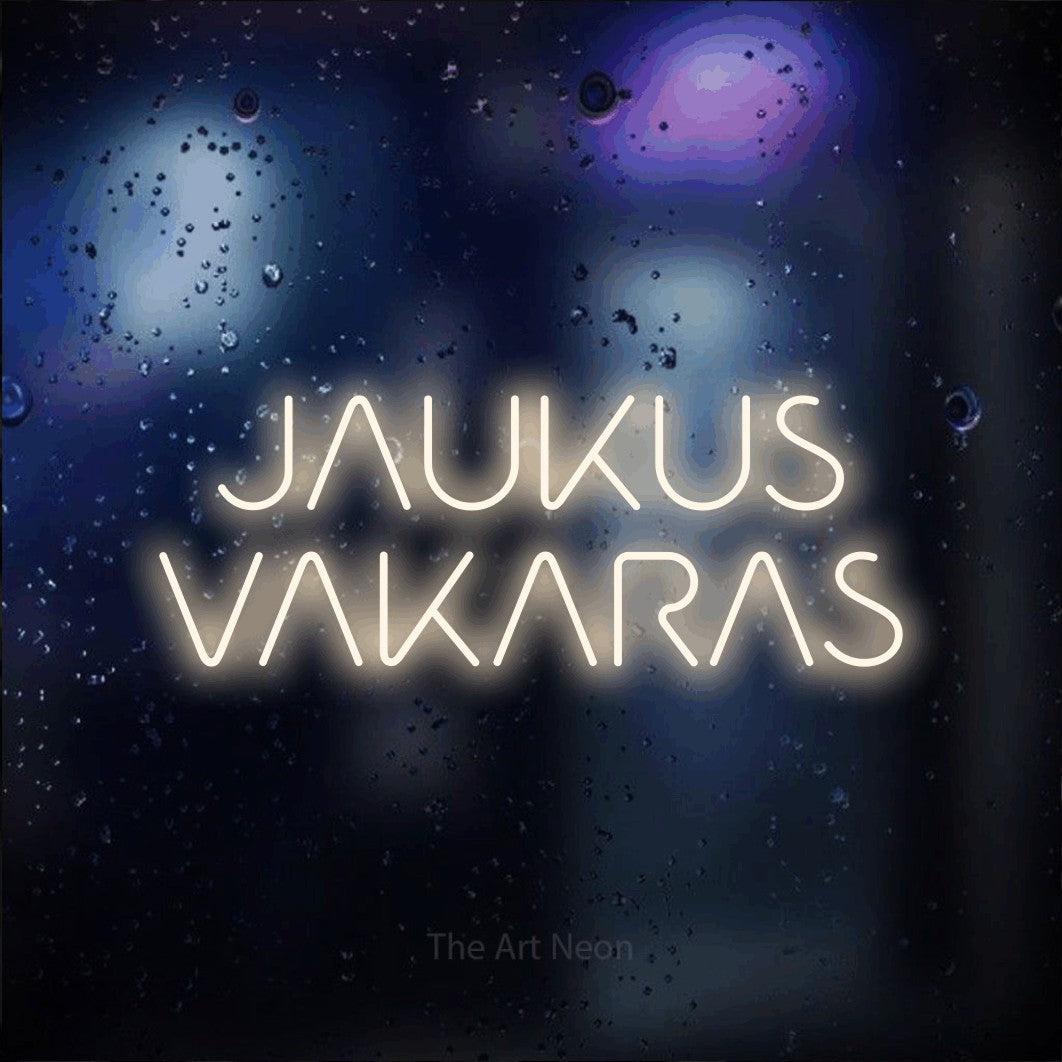 LED neon sign reading “JAUKUS VAKARAS”, arranged in two lines.