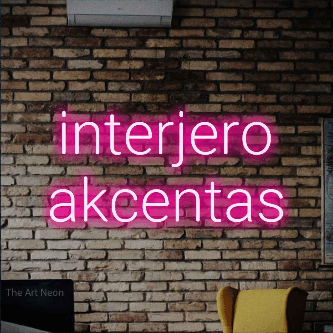 LED neon sign reading “interjero akcentas”, arranged in two lines.