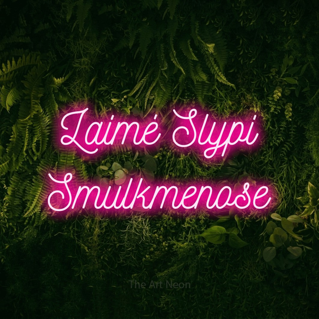 LED neon sign reading “Laimė Slypi Smulkmenose”, arranged in two lines.