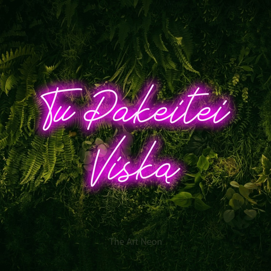 LED neon sign reading “Tu Pakeitei Viską”, arranged in two lines.