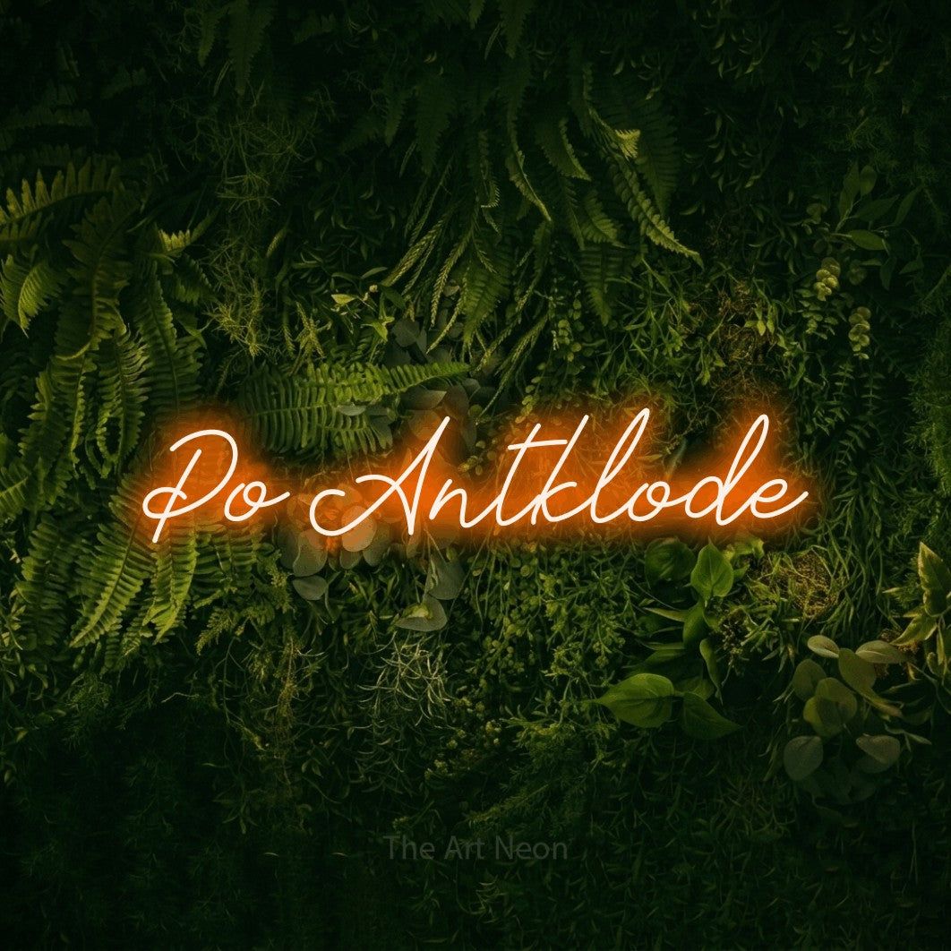 LED neon sign reading “Po Antklode”, arranged in a single line.