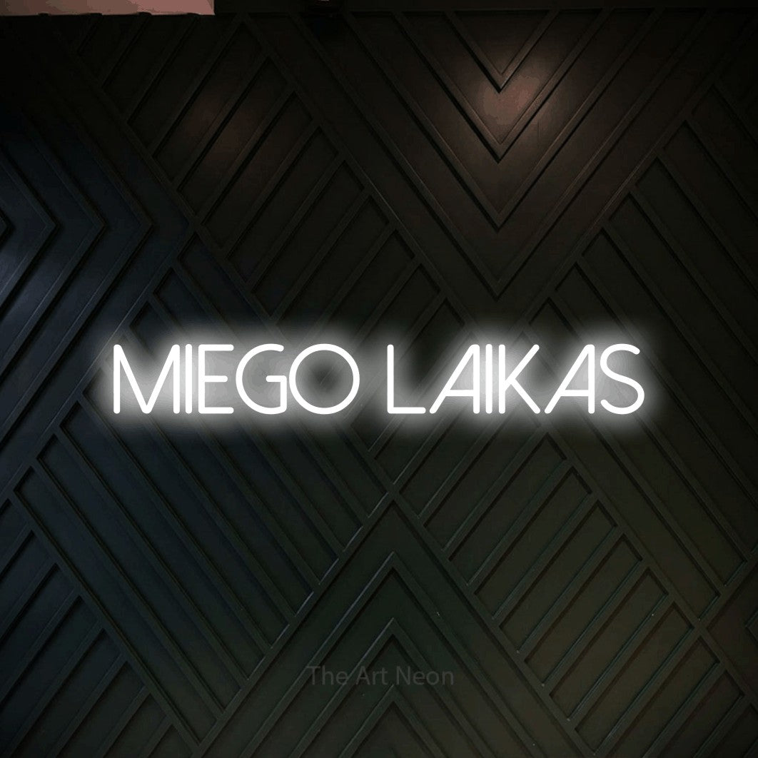 LED neon sign reading “miego laikas”, arranged in a single line.