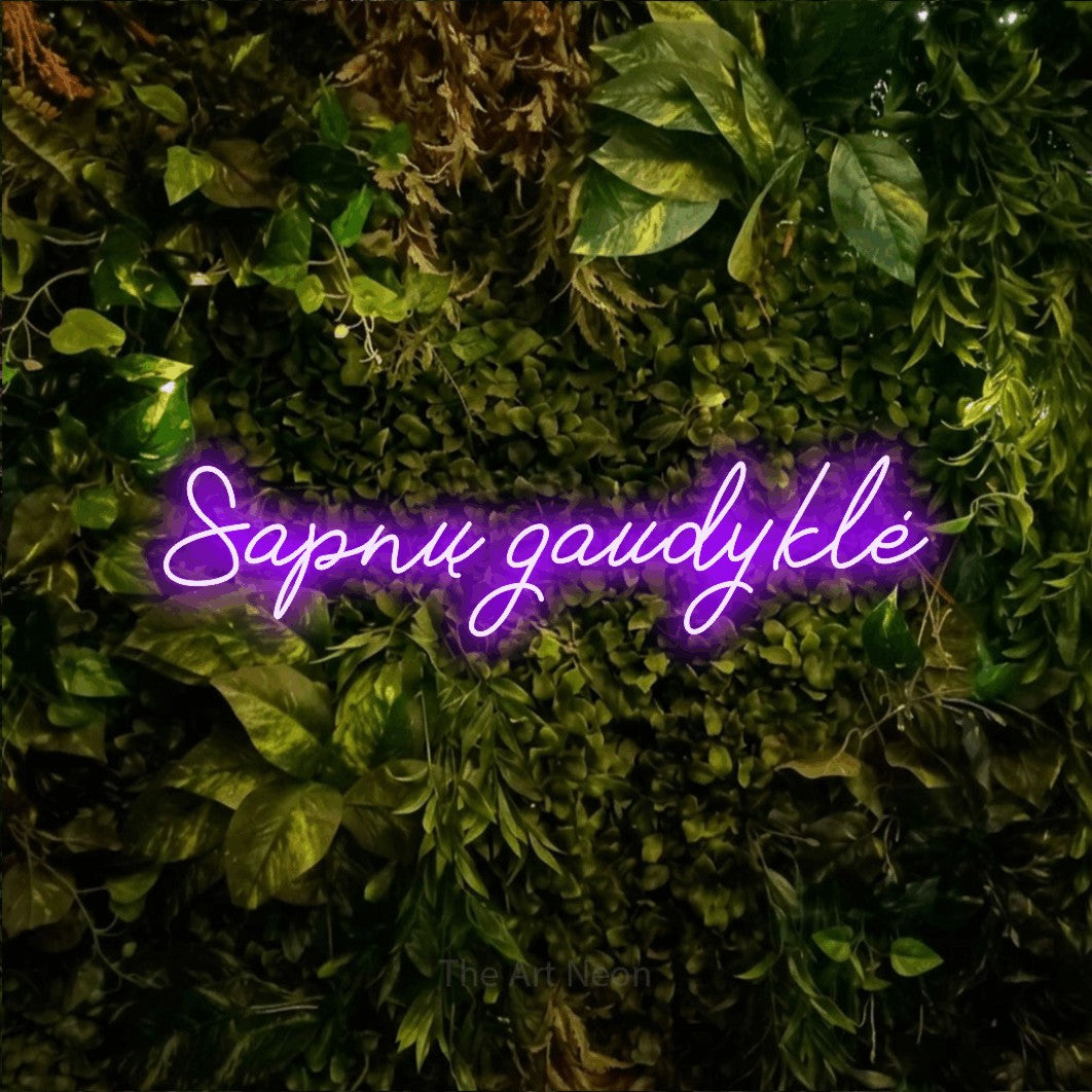 LED neon sign reading “Sapnų gaudyklė”, arranged in a single line.