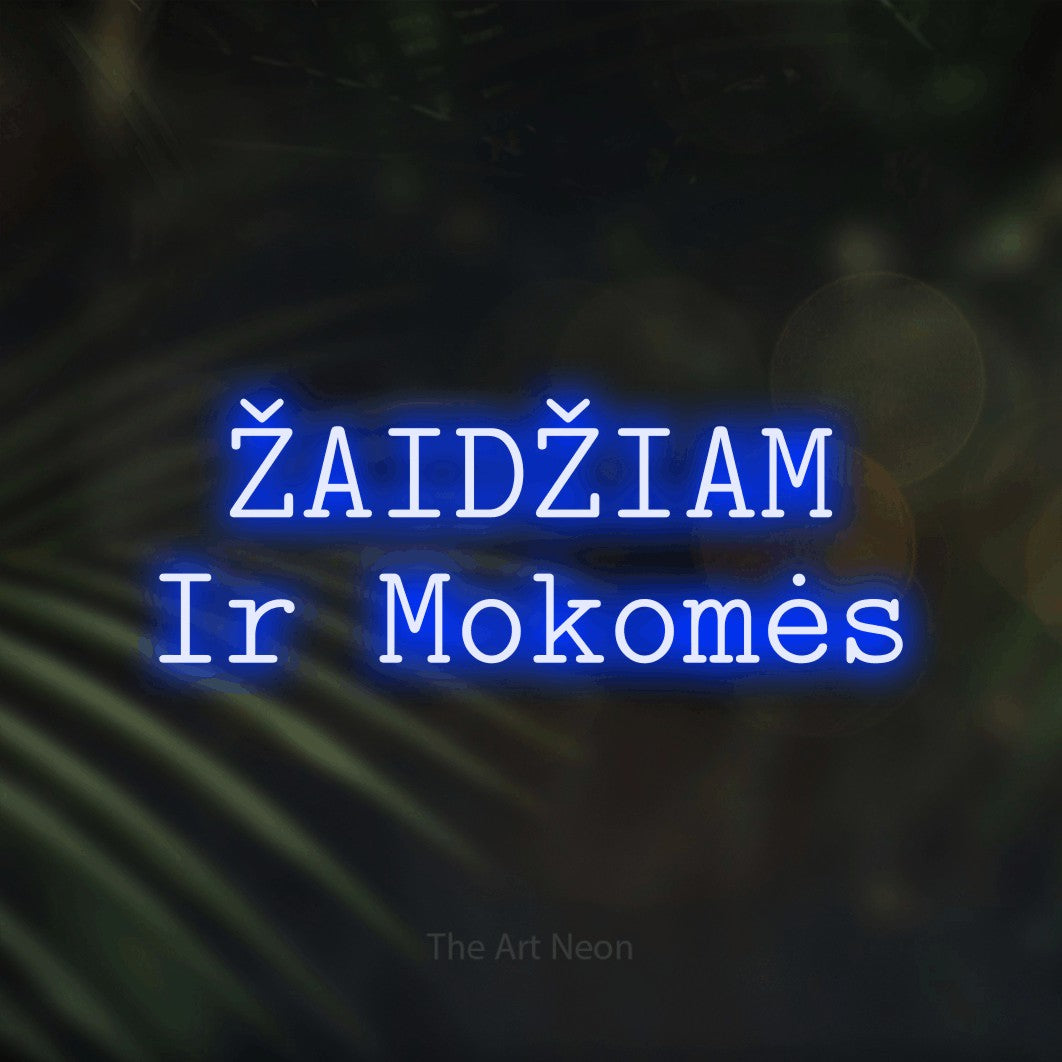 LED neon sign reading “ŽAIDŽIAM Ir Mokomės”, arranged in two lines.