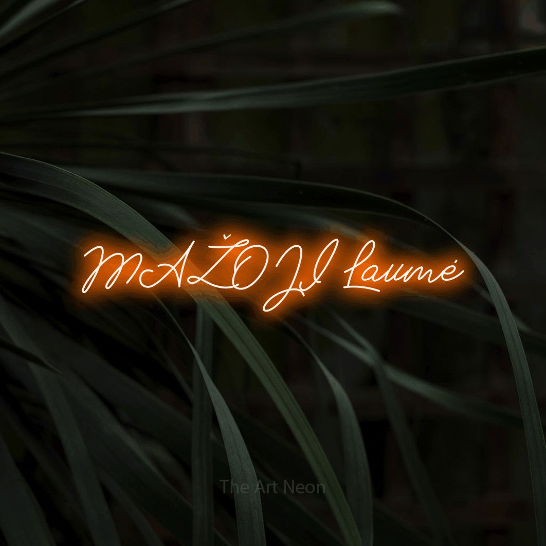 LED neon sign reading “MAŽOJI Laumė”, arranged in a single line.