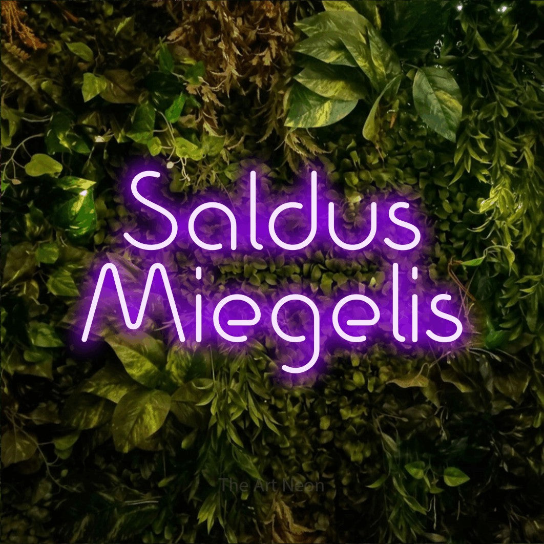 LED neon sign reading “Saldus Miegelis”, arranged in two lines.