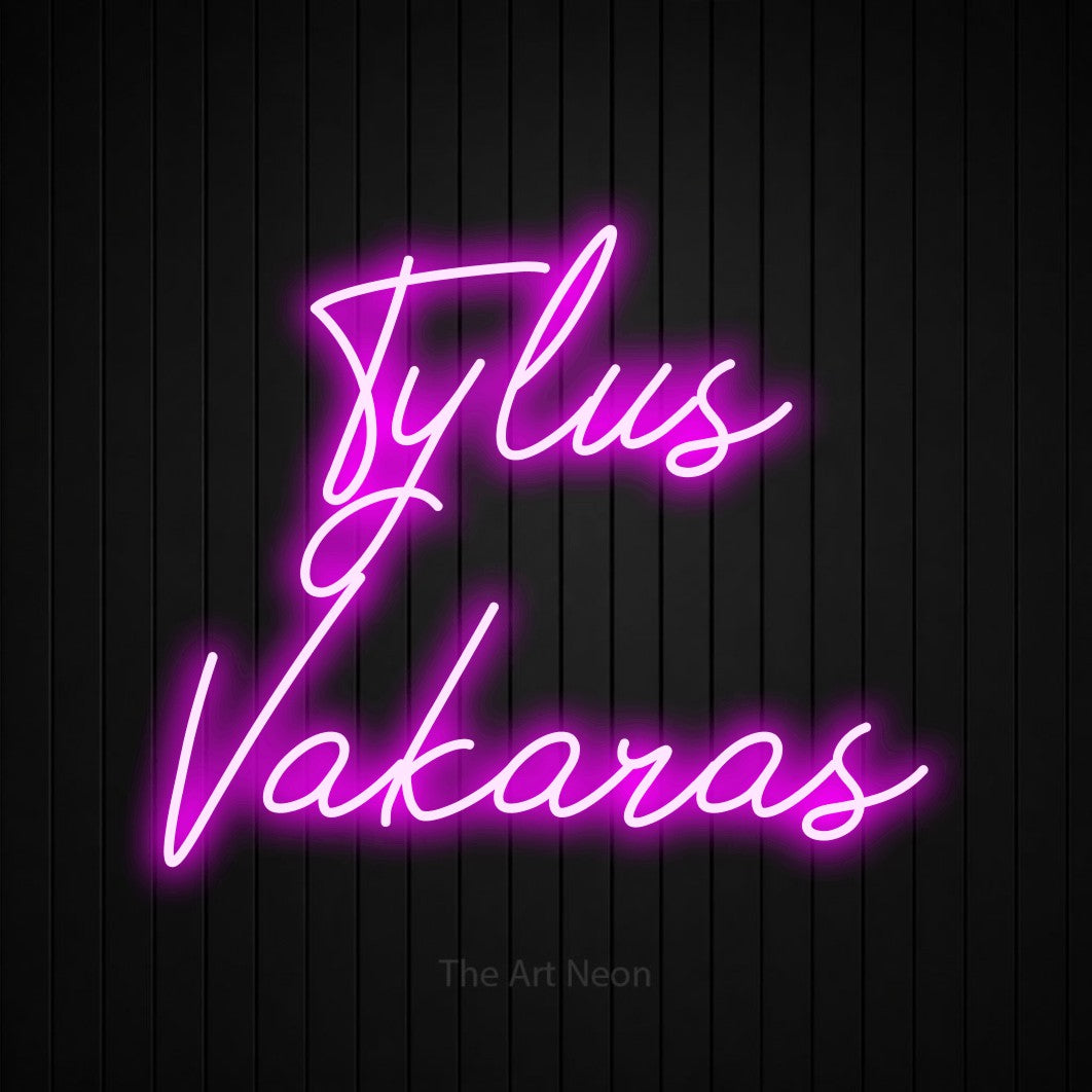 LED neon sign reading “Tylus Vakaras”, arranged in two lines.