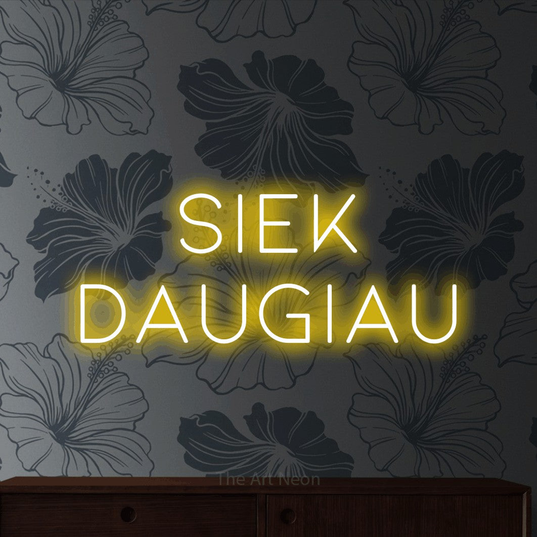 LED neon sign reading “SIEK DAUGIAU”, arranged in two lines.