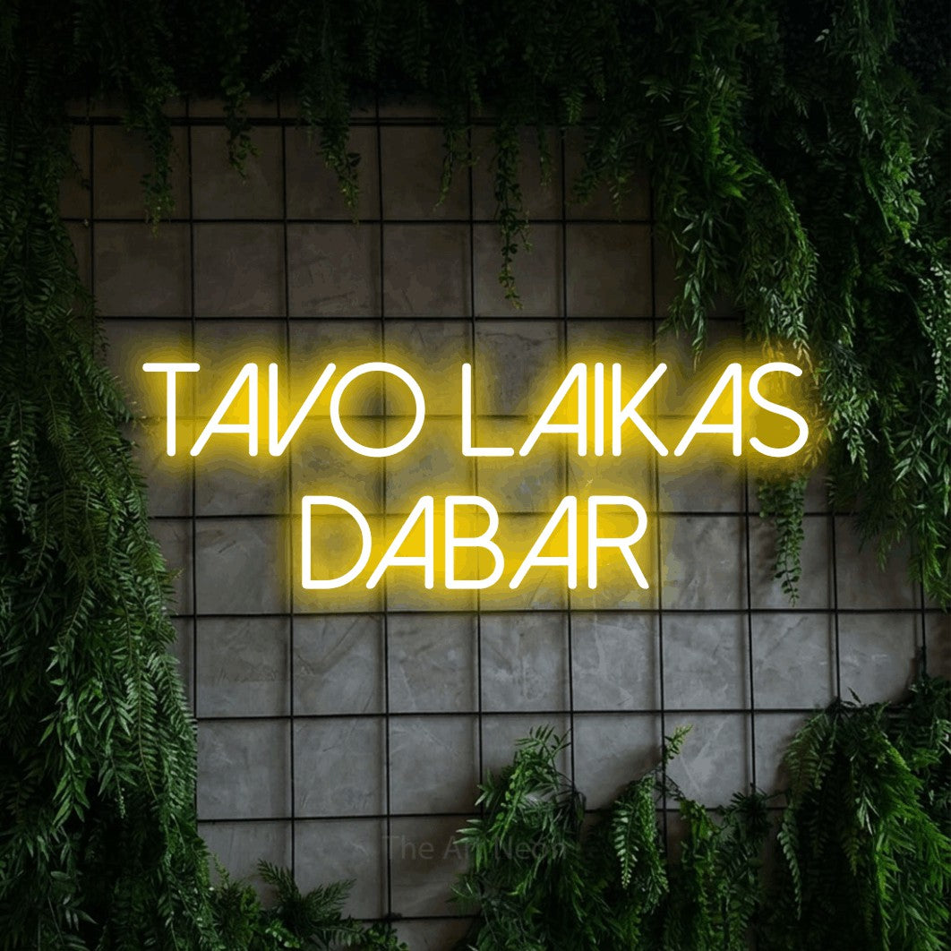 LED neon sign reading “Tavo LAIKAS Dabar”, arranged in two lines.
