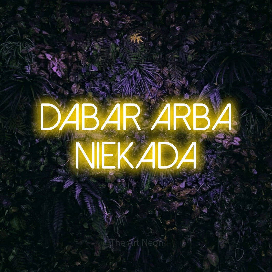 LED neon sign reading “Dabar Arba Niekada”, arranged in two lines.