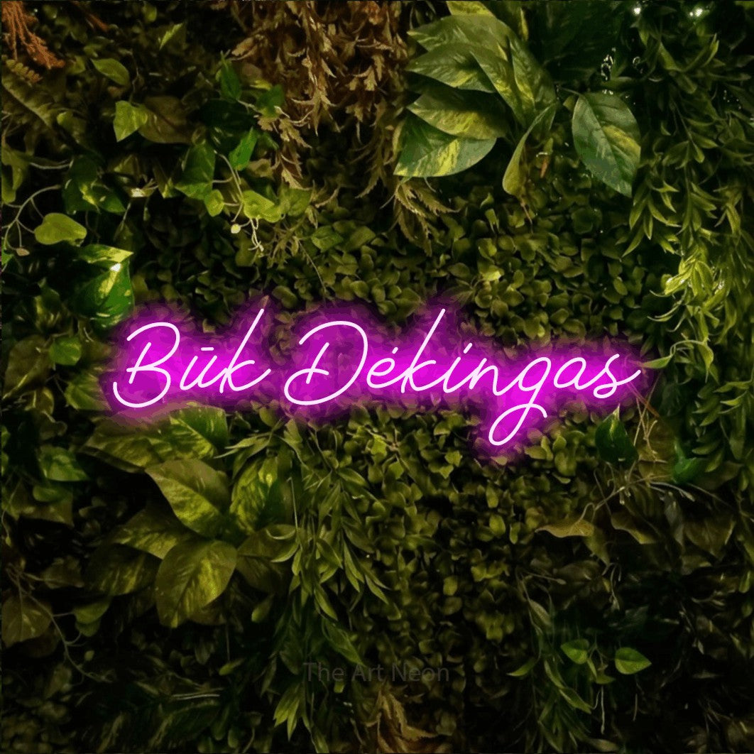 LED neon sign reading “Būk Dėkingas”, arranged in a single line.